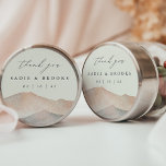 Sierra Dusk | Desert Mountain Wedding Thank You Runt Klistermärke<br><div class="desc">Add a refined finishing touch to your favors with this round sticker from the Sierra Dusk wedding collection by Redwood & Vine Design Co. The design features soft watercolor mountains in a romantic blend of blush, peach, and slate, accented by a flowing “thank you” script and your personalized names and...</div>