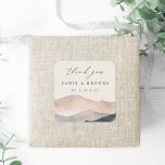 Sierra Dusk | Desert Sunset Wedding Thank You Fyrkantigt Klistermärke<br><div class="desc">Add a personal and stylish touch to your wedding favors with this square sticker from the Sierra Dusk collection by Redwood & Vine Design Co. The design showcases a soft watercolor mountain landscape in warm blush, peach, and slate tones, with elegant script reading “thank you” and customizable names and date...</div>