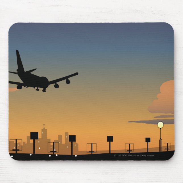 Silhouette av ett flygplan i flyg musmatta (Framsidan)