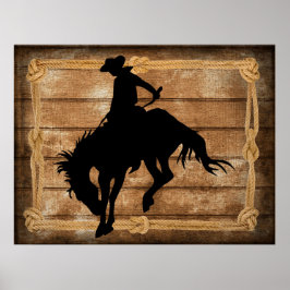 Silhouette cowboyen på en buckande bronkohäst poster