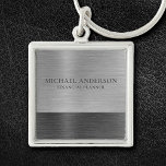 Silver Brushed Metall Metallic Monogram Namn Fyrkantig Silverfärgad Nyckelring<br><div class="desc">En klassisk nyckelkedja för silver grått borstat metall personlig. Koordinater med andra kontorsmateriel,  inklusive bindemedel,  anteckningsböcker och pennor. Designad av Blackberry Boulevard.</div>