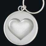 Silver glashjärtplåt rund silverfärgad nyckelring<br><div class="desc">Den här nyckelringen har ett formbart silver-hjärta med ett glasliknande utseende.</div>