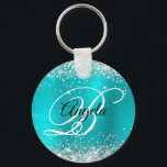 Silver Glitter Turquise Blue Foil Finare Monogram Nyckelring<br><div class="desc">Elegant silver glitter med gnistor mot ett faux aqua blue penselfolie av metall. Det går att anpassa kalligrafimonogrammet för svart och vitt finare i mitten. All sparsam och glansig inslag i denna moderna gigantiska design är digital grafik. Monogrammed värdefull cirkel formar nyckelring party favors för hennes speciella födelsedag.</div>