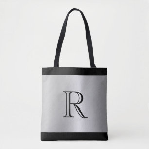 Silver Metallic Tittar bakgrund med Monogram Tygkasse