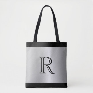 Silver Metallic Tittar bakgrund med Monogram Tygkasse