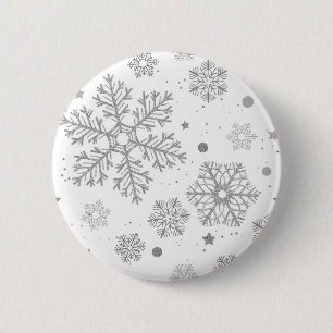 Silver snöflingor på vitt knapp