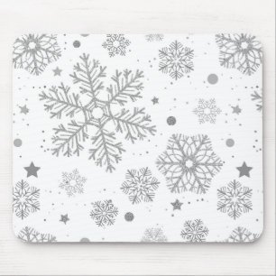 Silver snöflingor på vitt musmatta