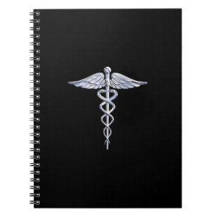 Silver som Caduceus medicintekniska symbol på svar Anteckningsbok Med Spiral