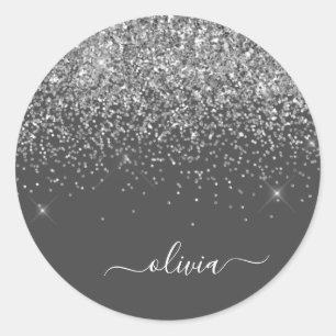Silvergrå glänsande glittermonogramnamn runt klistermärke