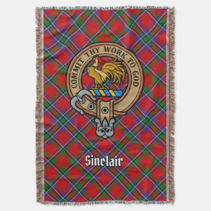 Sinclairklanens vapensköld över röd tartan filt