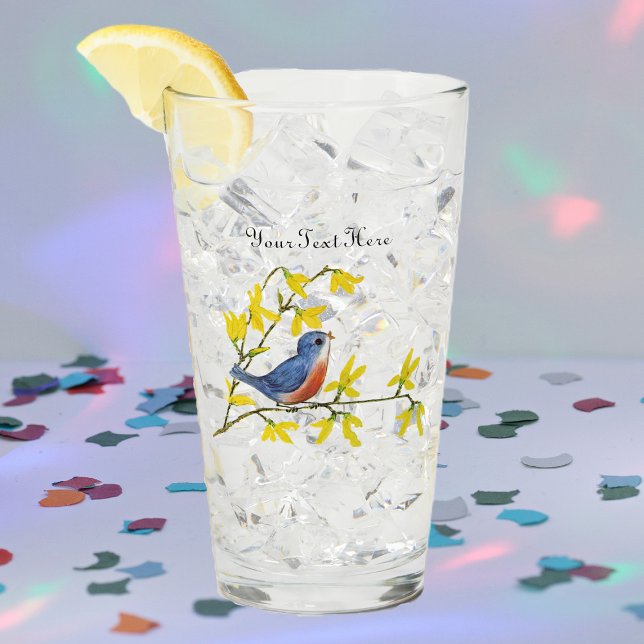 Singing Red Blue Bird on Gren Gula blommor Glaskopp (Singing bird in red and blue on a branch with pretty yellow flowers on a glass drink tumbler.)