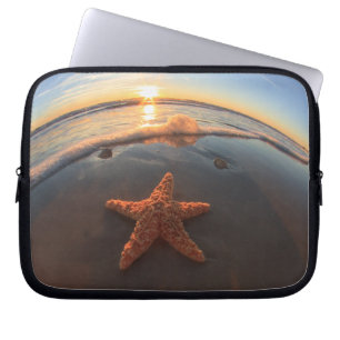 Sjöstjärna på strand på solnedgången laptop fodral