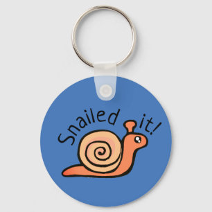 Skalade den (snigel) nyckelring