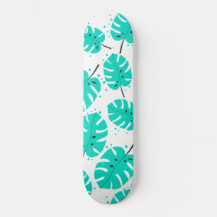 Skateboard med tropiska löv.