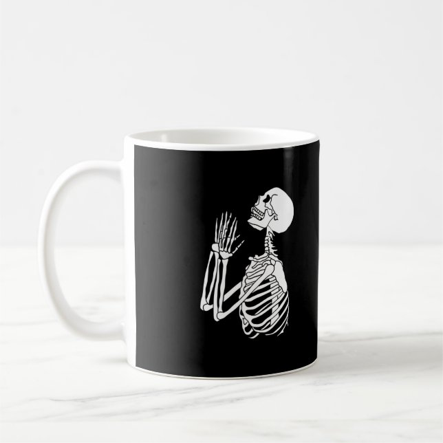 Skeleton ber om hjälp på en kaffemugg (Vänster)