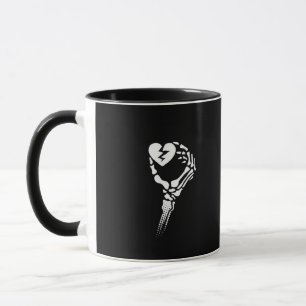 Skeleton Hand Holding Heart Mugg