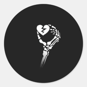 Skeleton Hand Holding Heart Runt Klistermärke