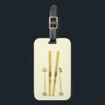 Sker och polacker i guld | Cream för illustration  Bagagebricka<br><div class="desc">Modern alpinskidor,  skidåkning,  skidor med skidor och poler från guld och guld. Enkel festlig skidåkning i guld för skidåkning i älskare.</div>