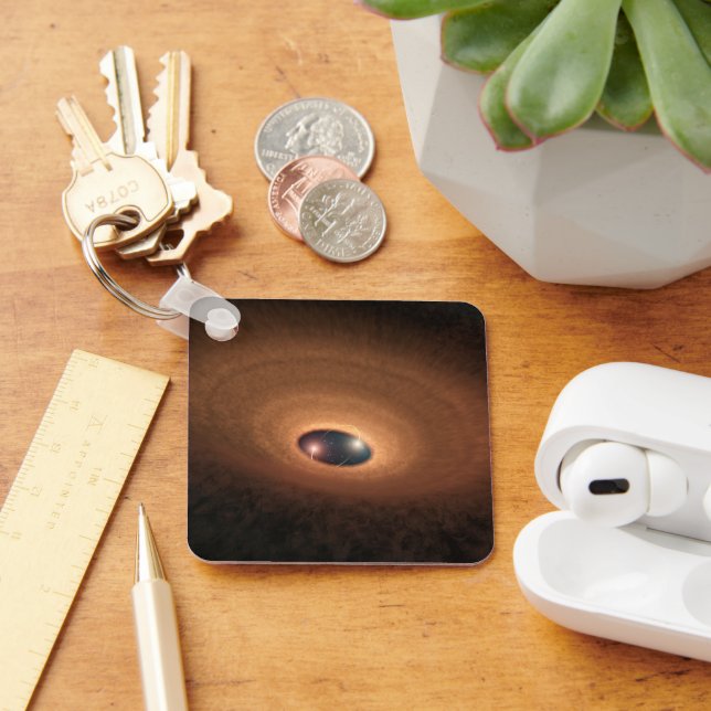 Skiva med dammhaltigt material som läcker från stj nyckelring (Skrivbord)