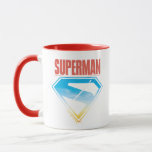Sköljning genom S-Shield Mugg<br><div class="desc">Släpp loss den heroiska energin hos stålmannen med denna djärva och inspirerande design! En silhuett av Superman-raketer skjuter upp, lämnar en briljant spår genom ett vibrerande himmel, alla inramade i sin ikoniska S-emblem. Den djupa röda bakgrunden kontrasterar på ett vackert sätt med himmel blå och gyllene nyanser som bläddrar igenom...</div>