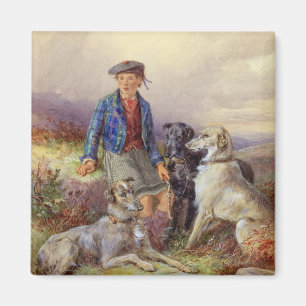 Skotsk pojke med wolfhounds i en höglands- landsc magnet