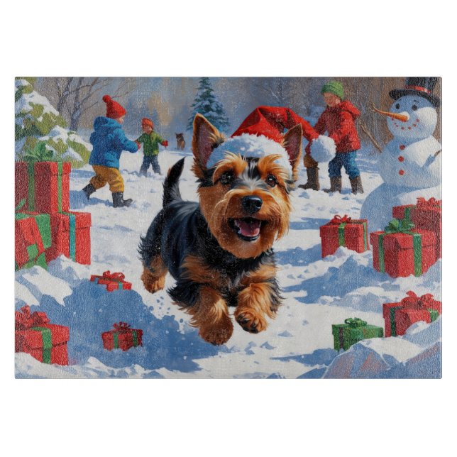 Skotsk terrier som springer i snö med julhatt (Framsidan)