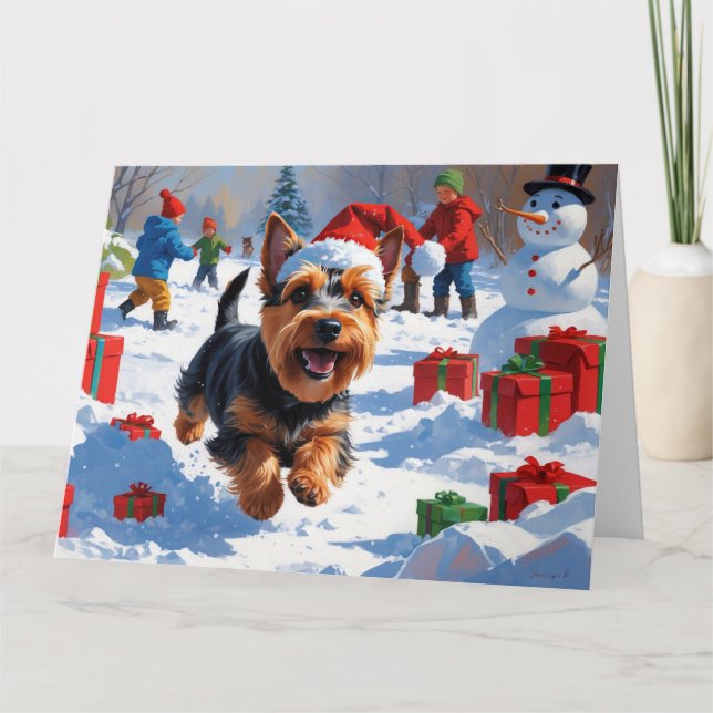Skotsk terrier som springer i snö med julhatt kort (Framsida)