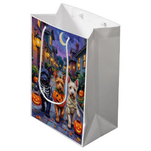 Skotska terrierhundar i Halloween-kostymer
