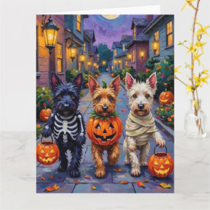 Skotska terrierhundar i Halloween-kostymer Kort