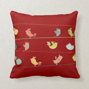 skraj fåglar på ett pillow_red bindakast kudde