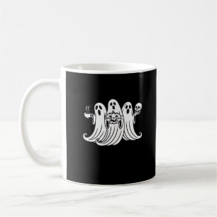 Skrämmande kaffedrickande pumpa som håller kaffemugg