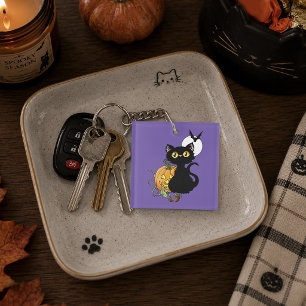 Skrämmande lila söt svart katt Halloween-pumpa