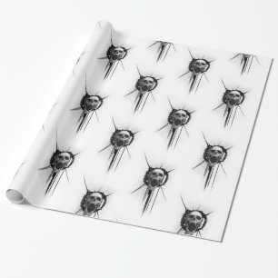 Skrikig skalle som slår in papper presentpapper