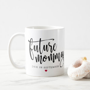 Skrivar den framtida mammor borstade svarten kaffemugg