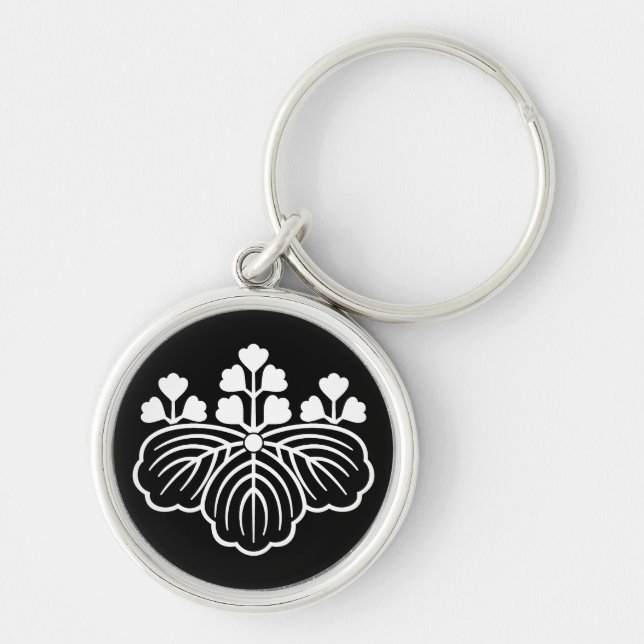 Skuggad paulownia med 5-3 blommor rund silverfärgad nyckelring (Framsidan)
