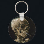 Skull med Burning Cigarette Vincent van Gogh Art Nyckelring<br><div class="desc">Vincent van Gogh (holländska, 1853-1890) Skull på en Skeleton med Burning Cigarette, 1885-86, Oil on canvas Unframed: 32 cm × 24, 5 cm (13 x 9, 6 tum) Tidigt arbete av Vincent van Gogh. Denna lilla målning är en del av den permanenta samlingen av Van Gogh-museet i Amsterdam. Det var...</div>