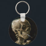 Skull med Burning Cigarette Vincent van Gogh Art Nyckelring<br><div class="desc">Vincent van Gogh (holländska, 1853-1890) Skull på en Skeleton med Burning Cigarette, 1885-86, Oil on canvas Unframed: 32 cm × 24, 5 cm (13 x 9, 6 tum) Tidigt arbete av Vincent van Gogh. Denna lilla målning är en del av den permanenta samlingen av Van Gogh-museet i Amsterdam. Det var...</div>