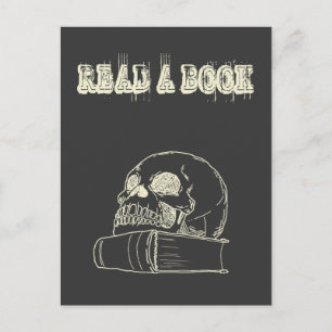 Skull och bok vykort