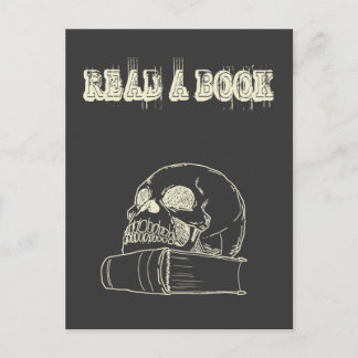 Skull och bok vykort
