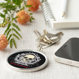 Skull och spadar från spelkort. rund silverfärgad nyckelring