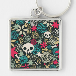 Skull på blommor fyrkantig silverfärgad nyckelring