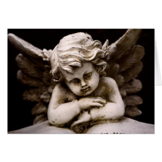 Skulptur av Cupid Angel som läser en Bok Hälsningskort