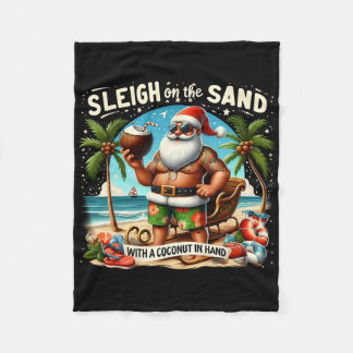 Släd på sanden med en kokosnöt i handen jul fleecefilt