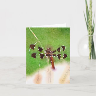 Sländan som vilar på gräs, noterar kortet kort