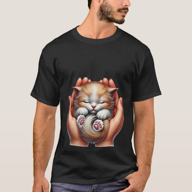 Sleeping Kitten Cradled in Hands Tiny Fluffy Cat  T Shirt (Framsida)