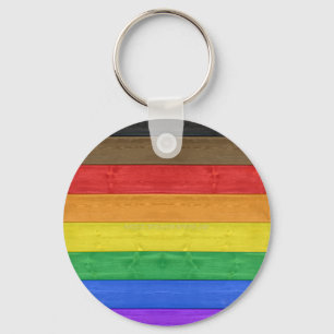 SlipperyJoes inkluderande träblak av gay pride fla Nyckelring