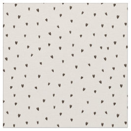 Små, svarta hörn på ljus tyg