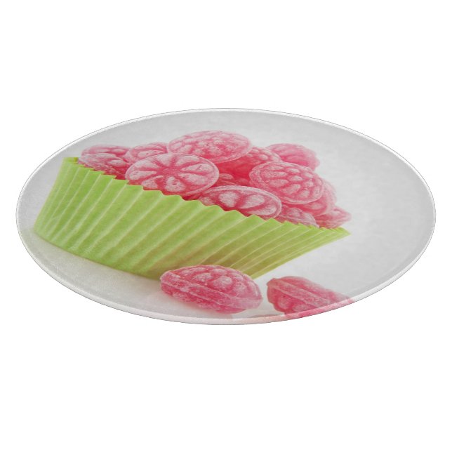 Smakliga godissötsaker för hallon i grön kopptårta (Hörn)