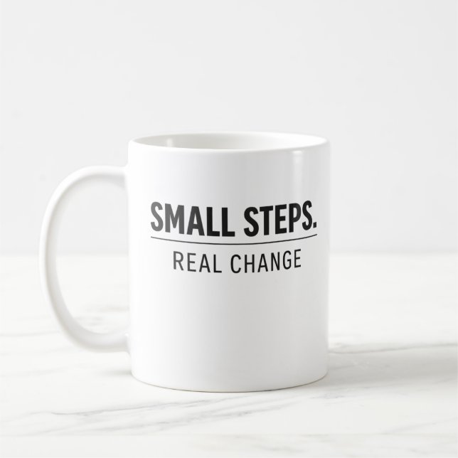 Small Steps Real Change – Minimal Motivation Hoodi Kaffemugg (Vänster)