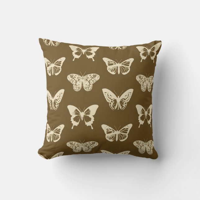 Smörflygsketch, beige på chokladbrun kudde (Framsida)